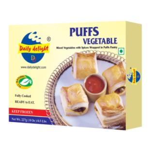Daily Delight Vegetable Puffs. Crispy pastry with spicy veg filling. Perfect tea time snack.